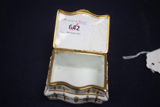 A late 18th / early 19th century French gilt metal mounted commode shaped white enamel snuff box, 3in.